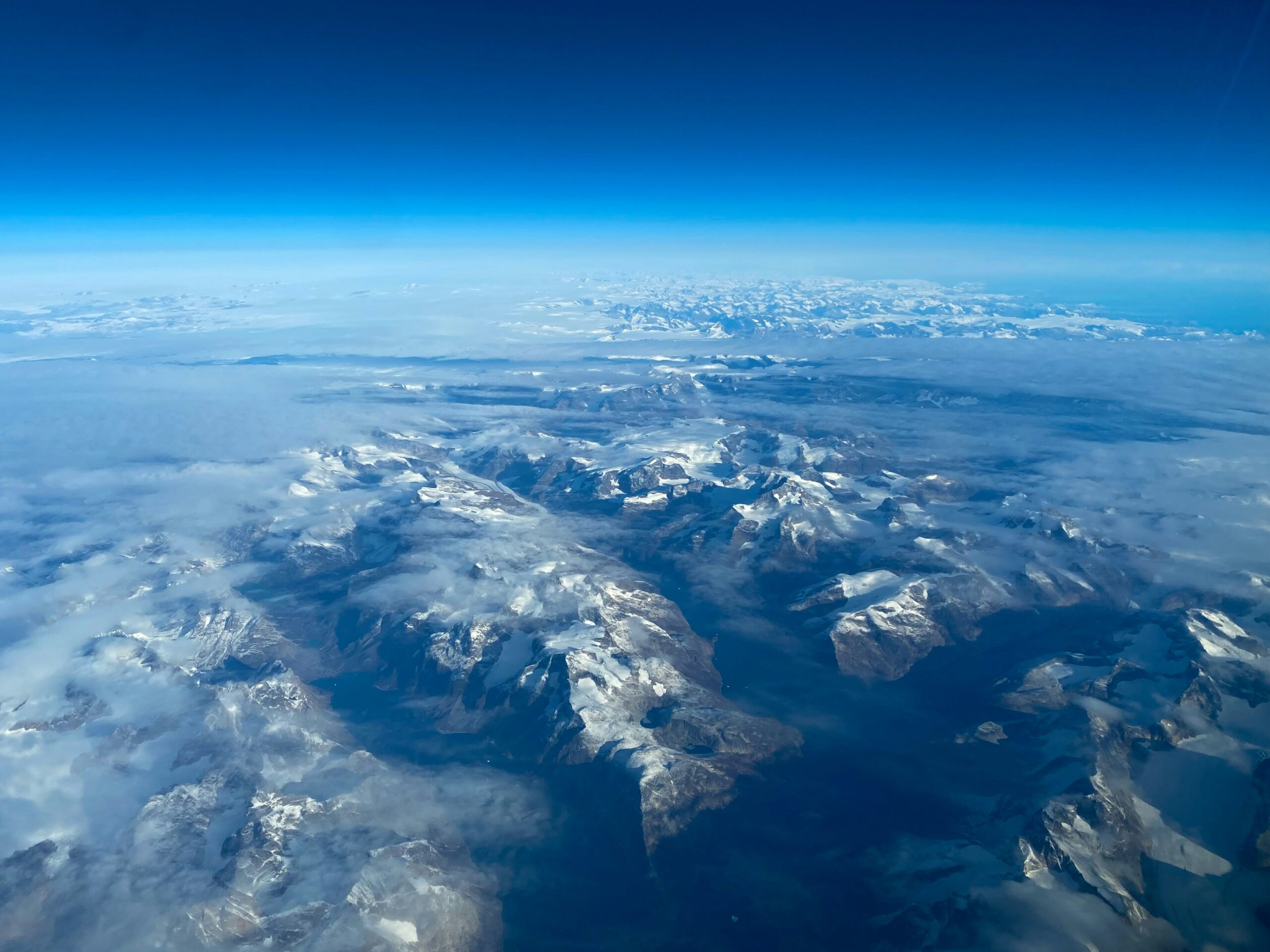 Aerial view of mountains and blue skies.