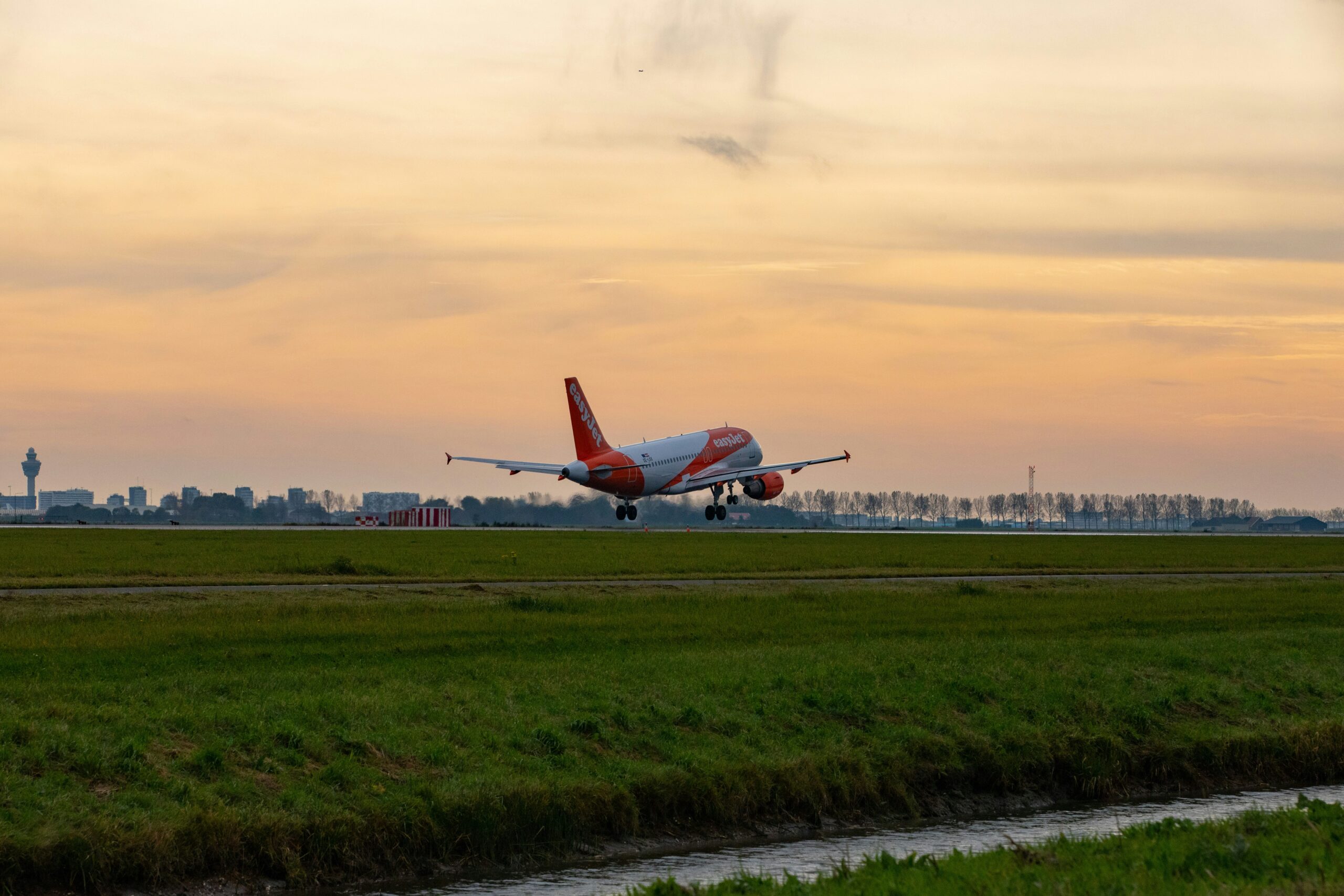 EasyJet aircraft taking off, sunset time 