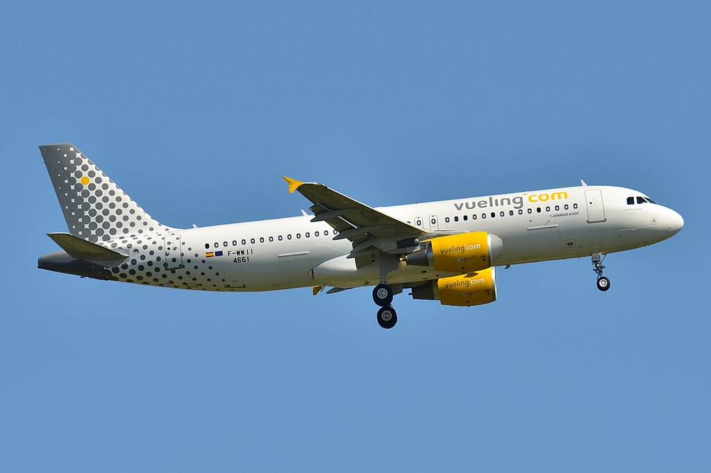 The image depicts an Italian aircraft flying in the sky