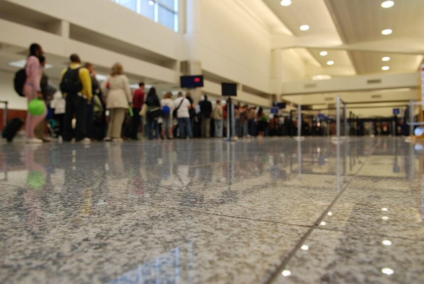 people, barricades, security desk
