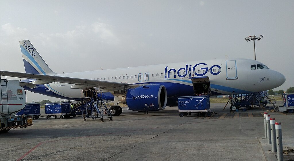 exterior of an aircraft, wide shot, indigo logo