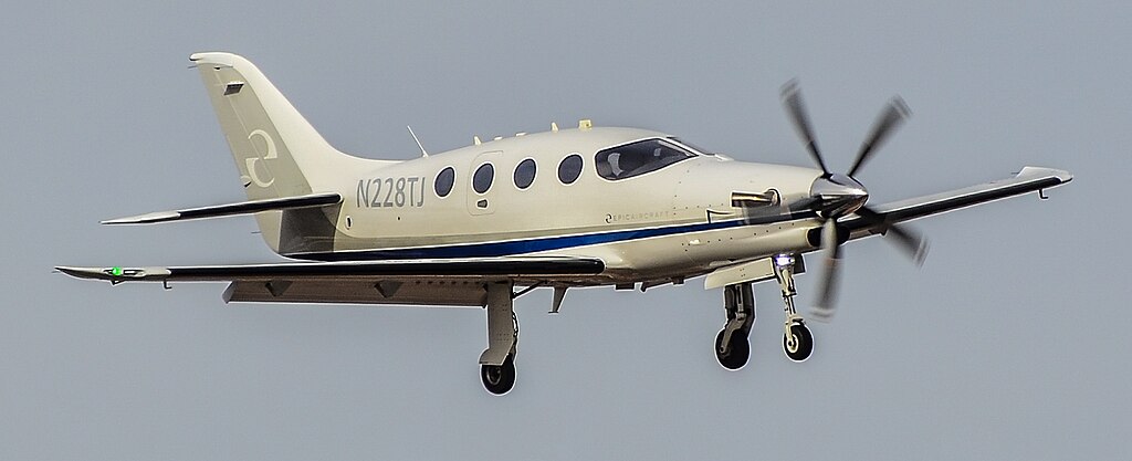 plane, n228tj, flying over, propellers in motion