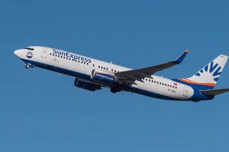 This image shows the SunExpress flight flying in the sky