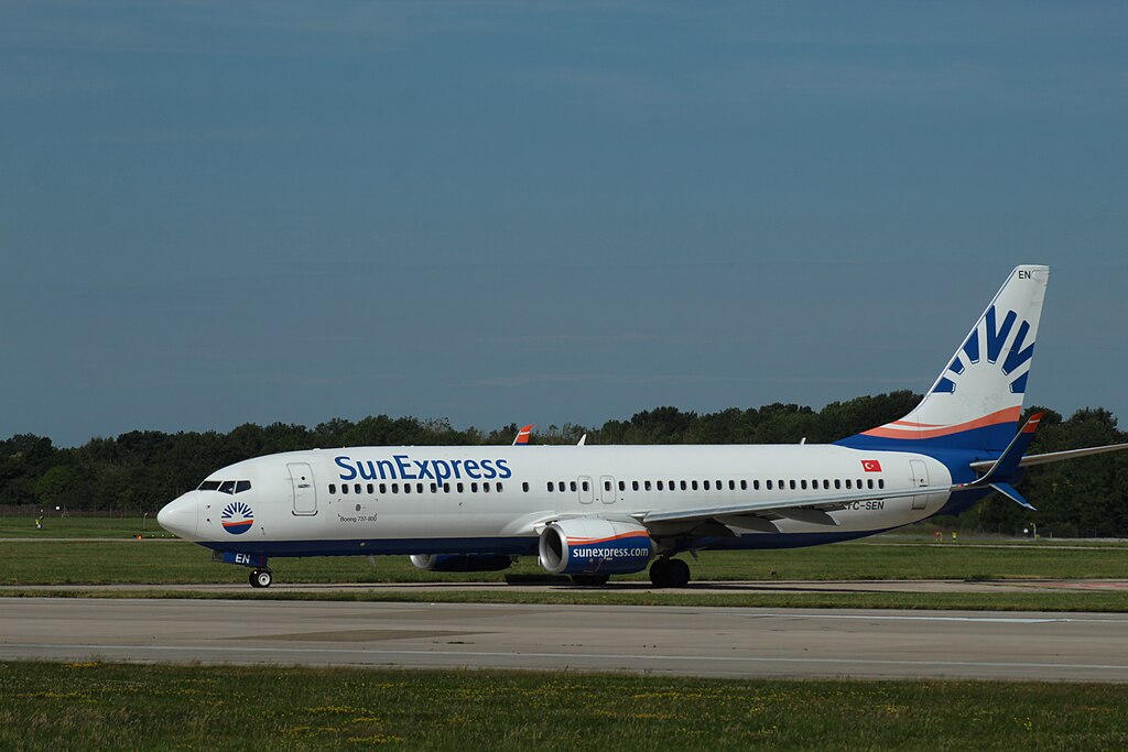 The image depicts an aircraft in the taxiway