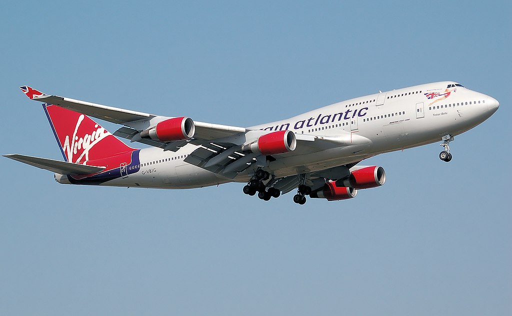 A Virgin Atlantic aircraft flying in a blue sky