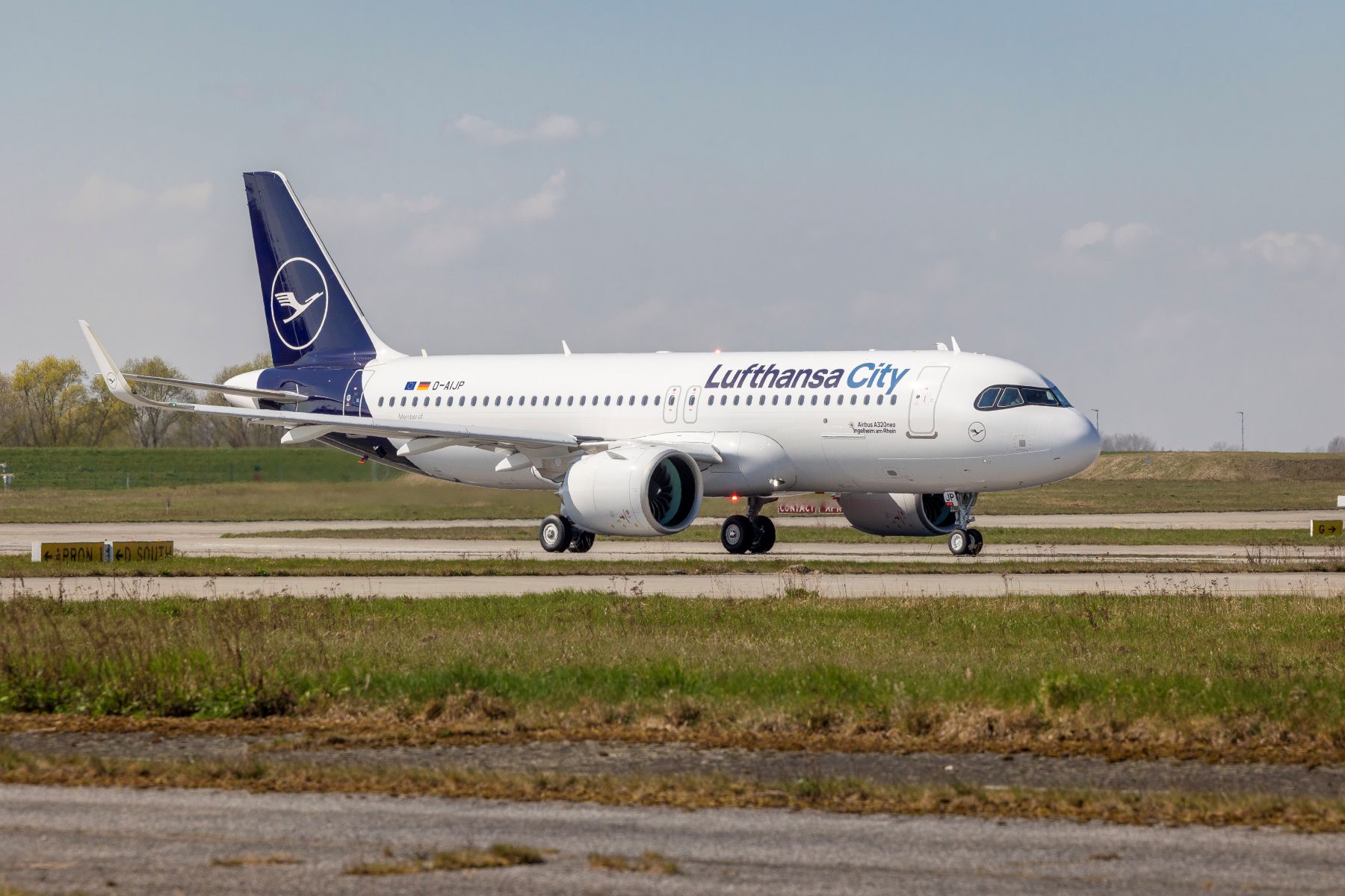 An Lufthansa City Airline aircraft on the runway.