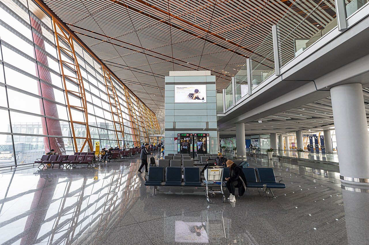 The terminal 3 waiting area of Beijing Capital Airport, with a long window and high ceilings.