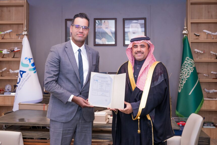 CEO of AirX, Houssam Hazzoury, shaking hands with someone, holding a document.
