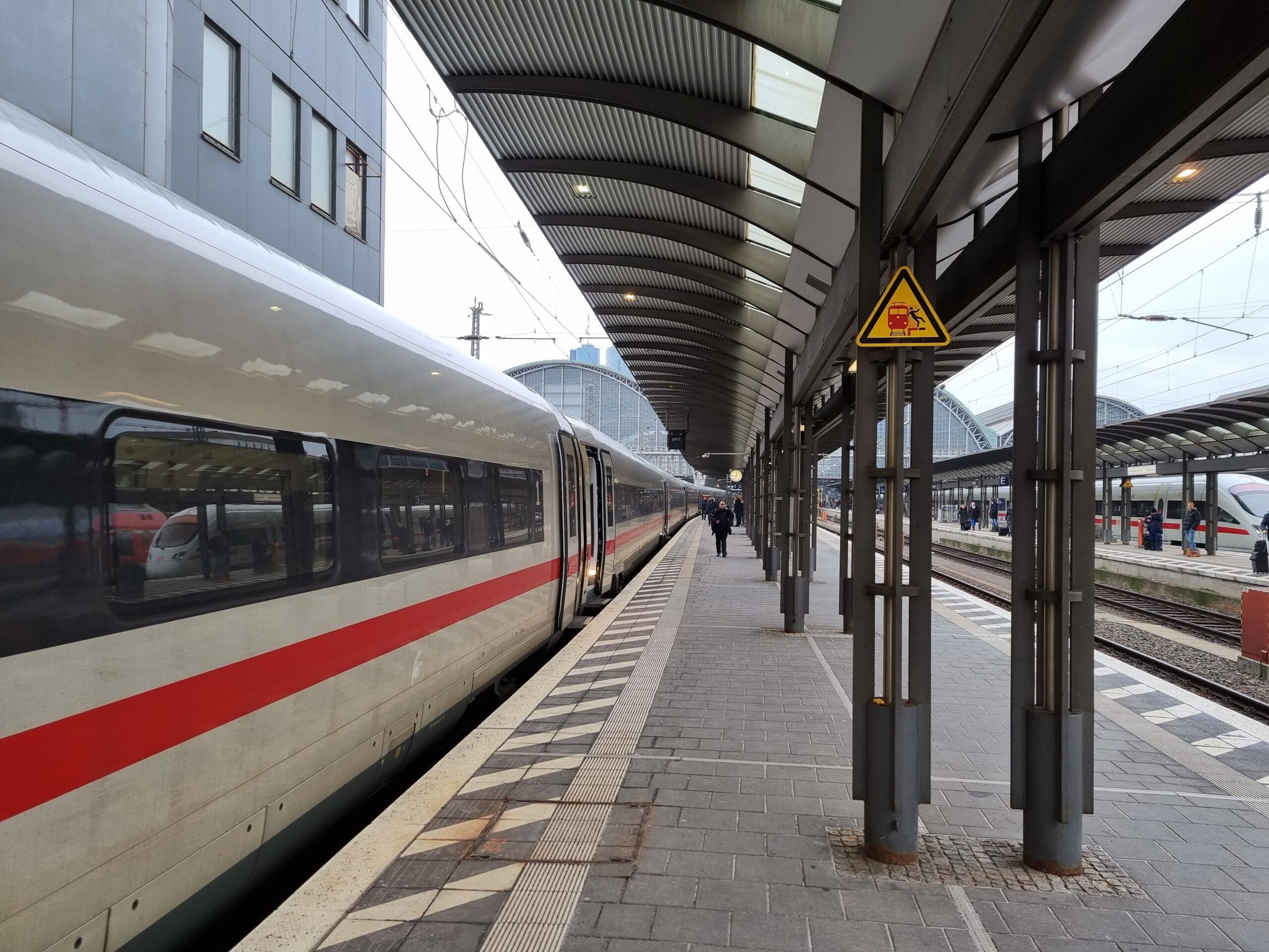 A Deutsche Bahn train arrives on the platform.