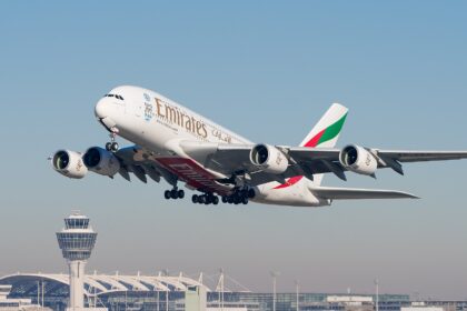 Emirates Airbus A380-861 taking off in a sunny day