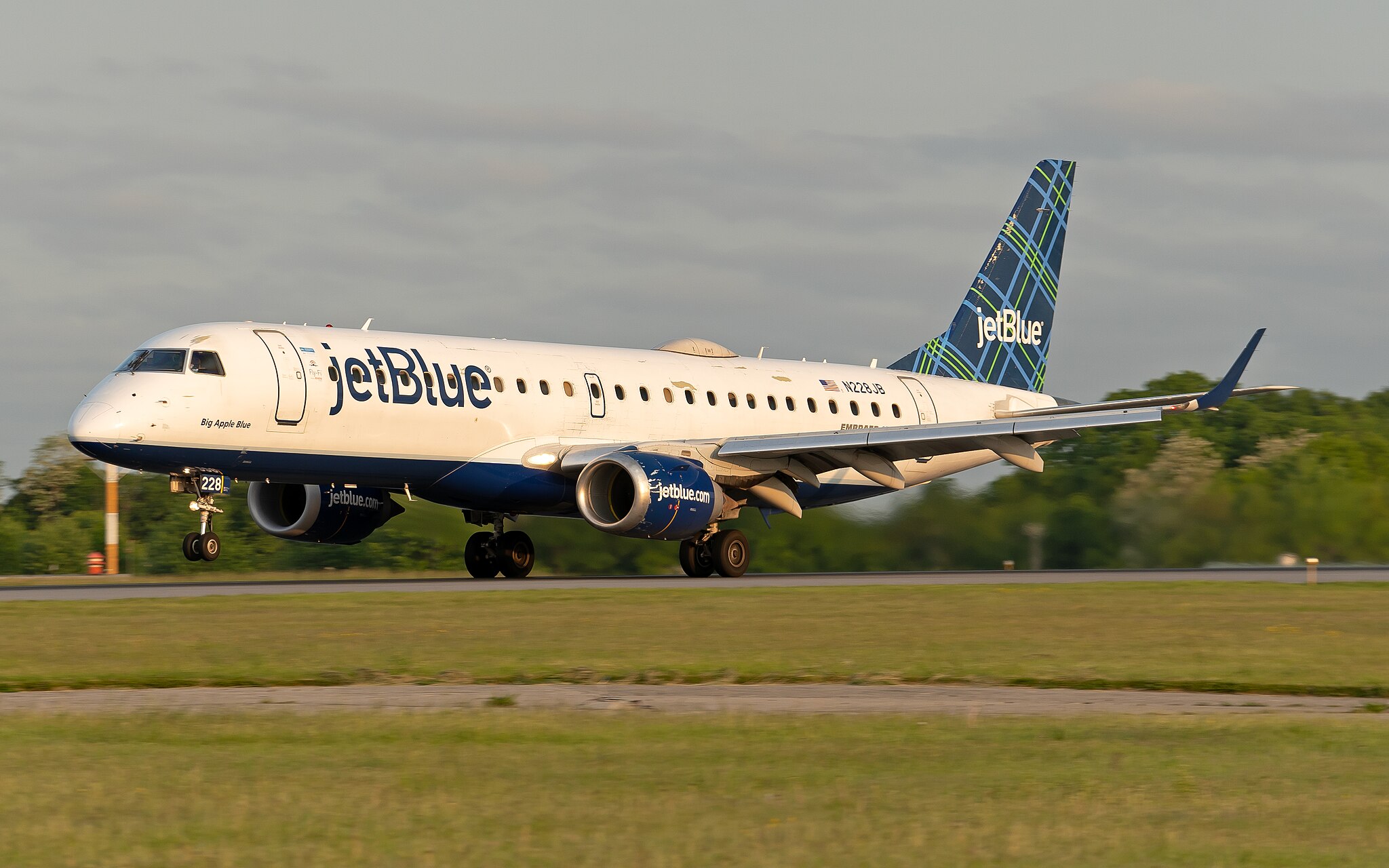 An Embraer E190 of JetBlue Airways (N228JB) after just touching down on Runway 16 at KHPN (Westchester County Airport).