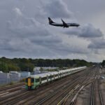 As a Ryanair Boeing 737-800 passes over on final approach, 377424 departs Gatwick Airport at the rear of 1J78 14:36 Victoria - Horsham & Bognor Regis.