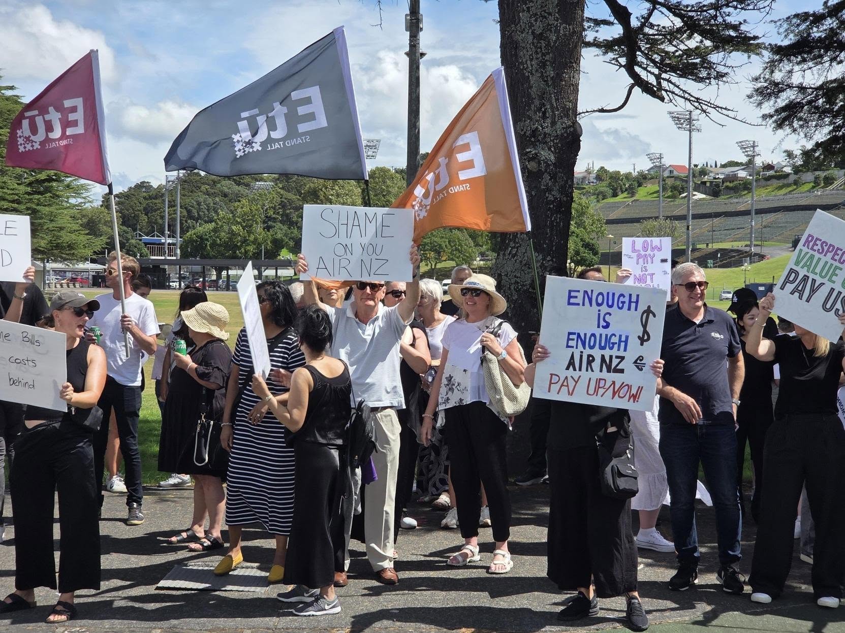 Air New Zealand cabin crew picketing during strike that has stranded thousands of passengers on long-haul routes.