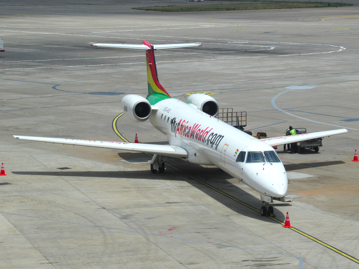 An Embraer ERJ-145LR of Africa World Airlines with registration 9G-AFQ parked at Nnamdi Azikiwe International Airport in Abuja, Nigeria