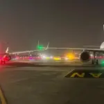 Runway lights and A320 wingtips are seen after a minor collision at Mumbai Airport; passengers evacuated safely as DGCA investigates.