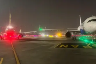 Runway lights and A320 wingtips are seen after a minor collision at Mumbai Airport; passengers evacuated safely as DGCA investigates.