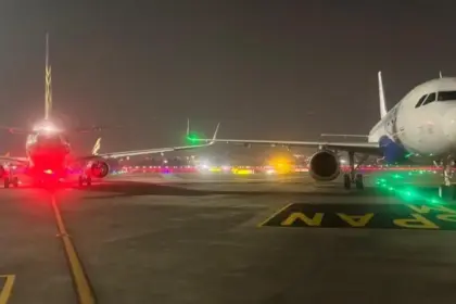 Runway lights and A320 wingtips are seen after a minor collision at Mumbai Airport; passengers evacuated safely as DGCA investigates.