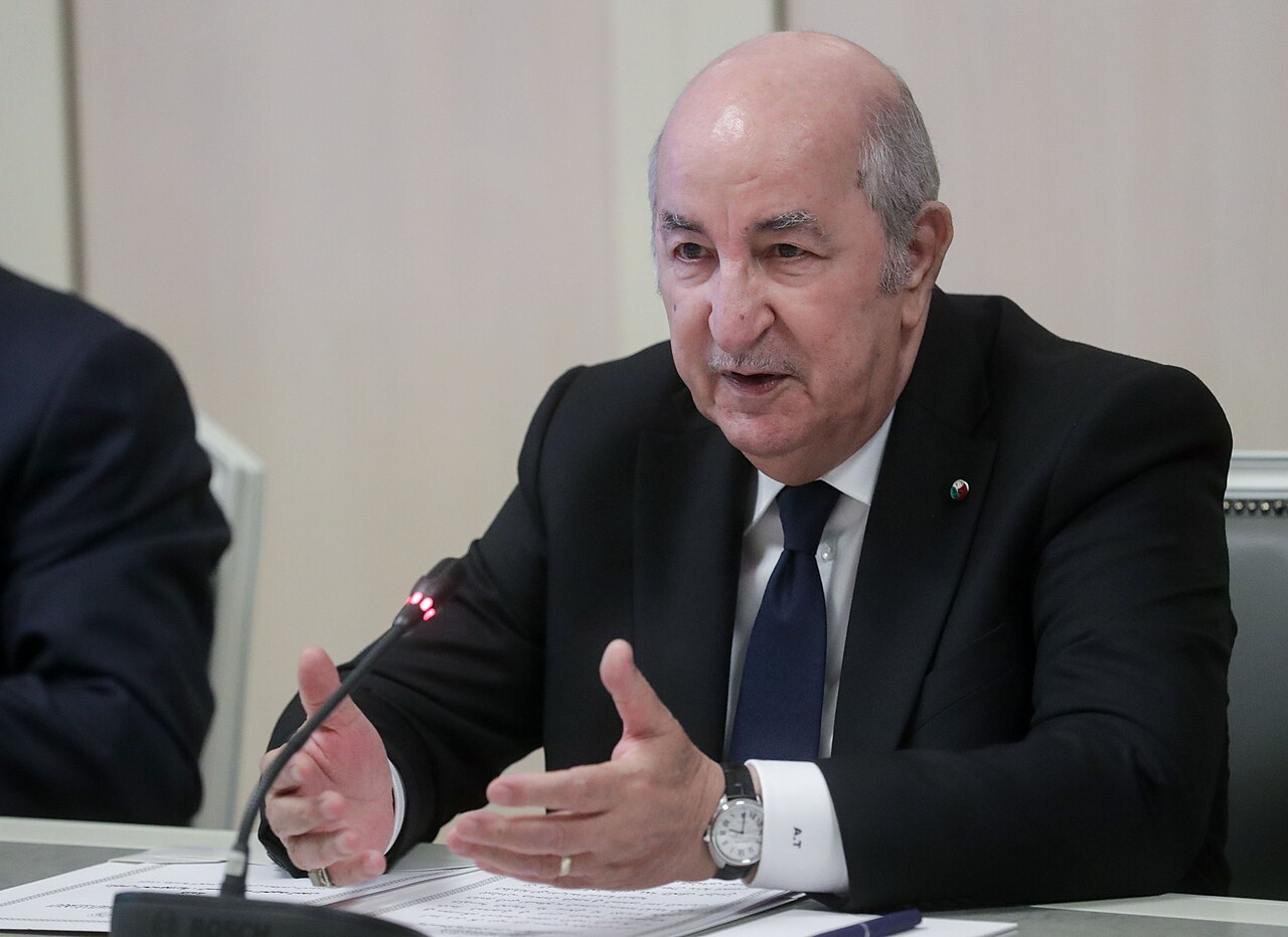 Algerian President Abdelmadjid Tebboune speaking during an official meeting.