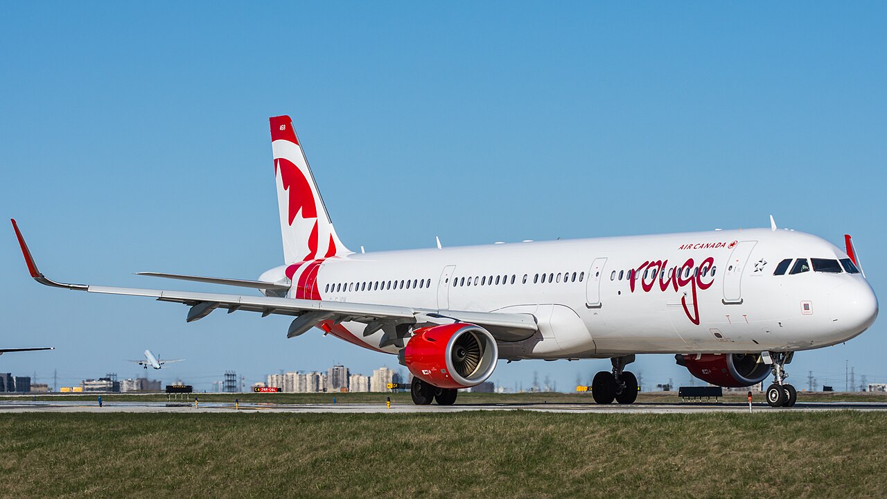 Air Canada Rouge Airbus A321 aircraft on the runway.