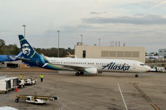 A Boeing 737-900ER stationed at terminal