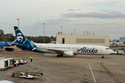 A Boeing 737-900ER stationed at terminal