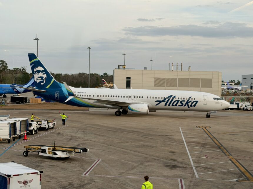 A Boeing 737-900ER stationed at terminal