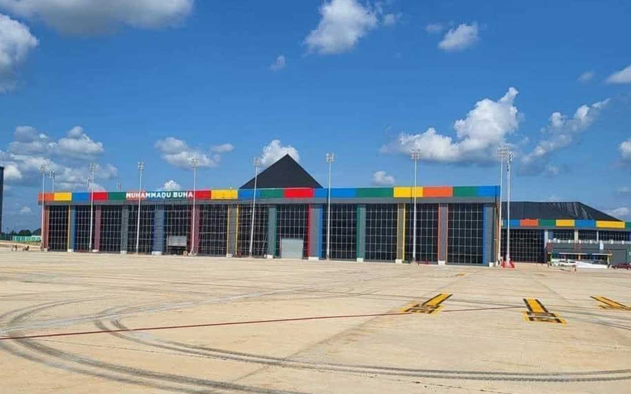 Ebonyi Chuba Okadigbo International Airport showing the runways and terminal building in the background, with rainbow-colored accents on the structure