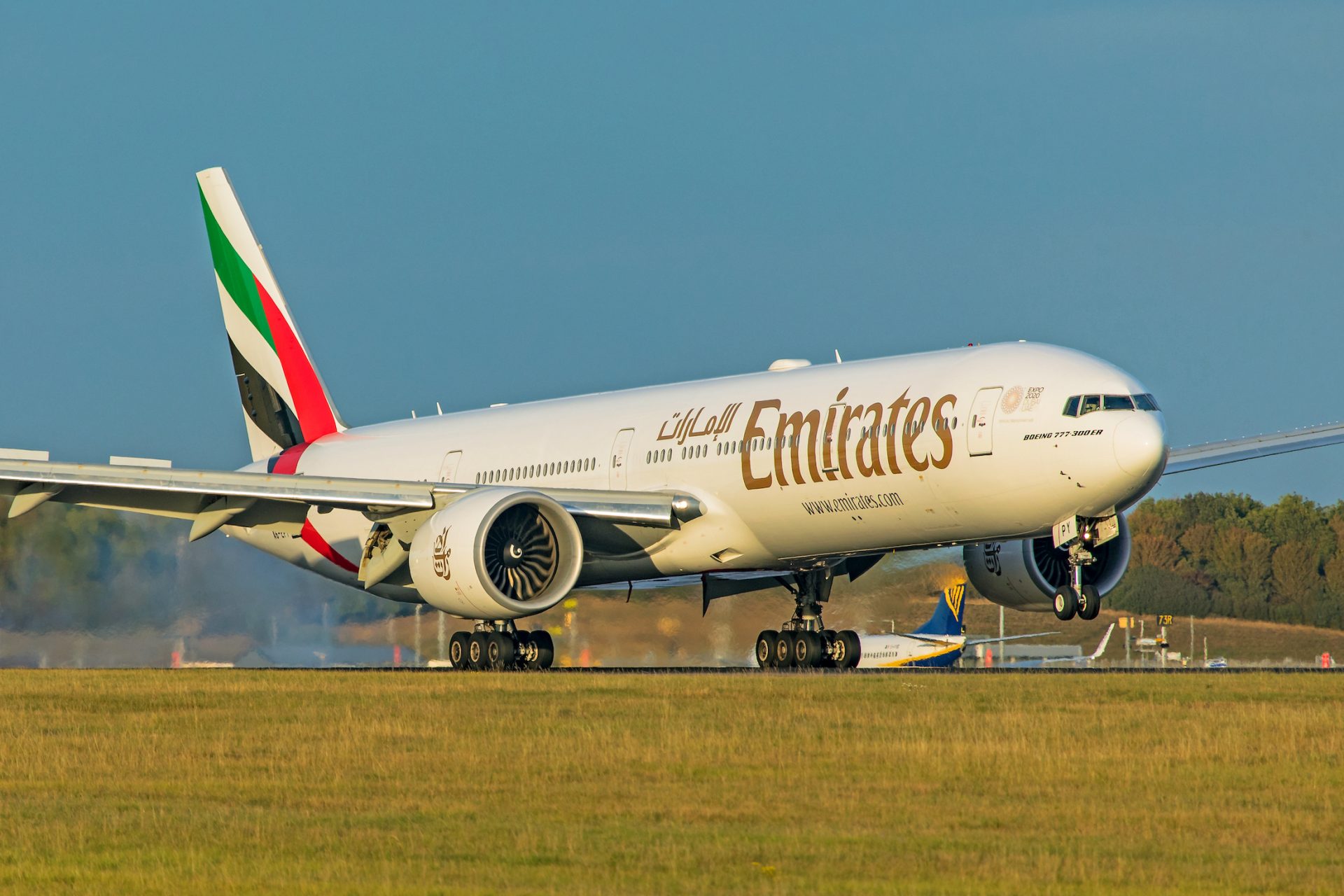 Emirates Boeing 777-300ER taking off from runway 
