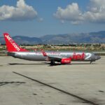 Jet2 aircraft on the tarmac, grey and red livery.