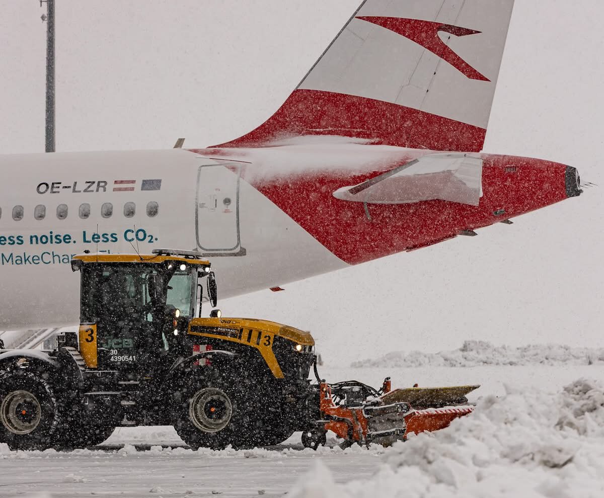 This image shows that the aircraft is surrounded by snow, and the vehicle is clearing it