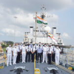 Indigo staff, onboard a ship, India flag, masks