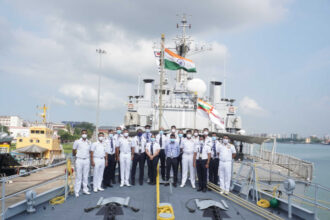 Indigo staff, onboard a ship, India flag, masks