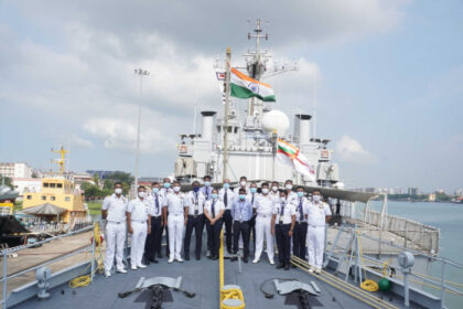 Indigo staff, onboard a ship, India flag, masks