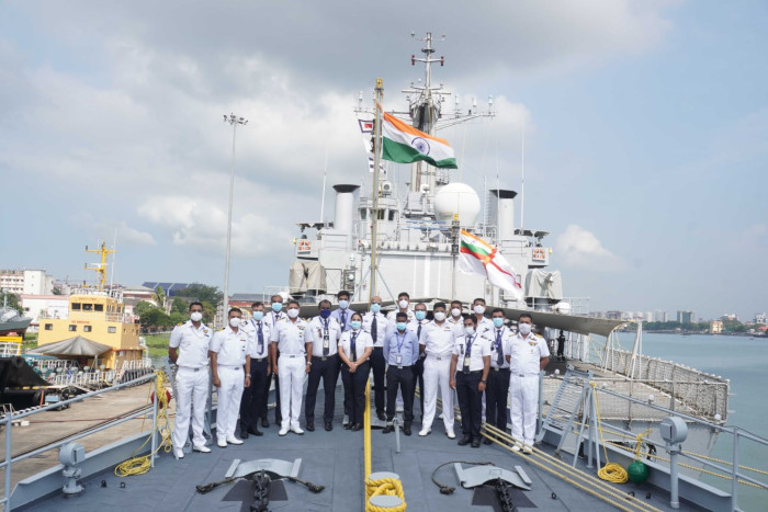 Indigo staff, onboard a ship, India flag, masks
