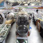 Interior of the Avro Heritage Museum at Woodford, showing aircraft nose sections and exhibits as part of the Avro Heritage Museum expansion and Avro aircraft preservation in the UK.