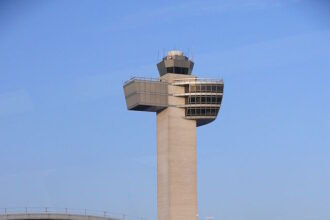 The air traffic control tower at John F. Kennedy International Airport (JFK).