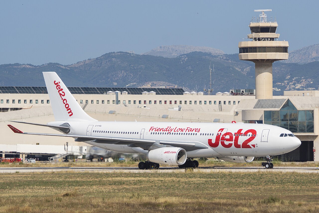 Jet2 aircraft on runway, white and red livery.