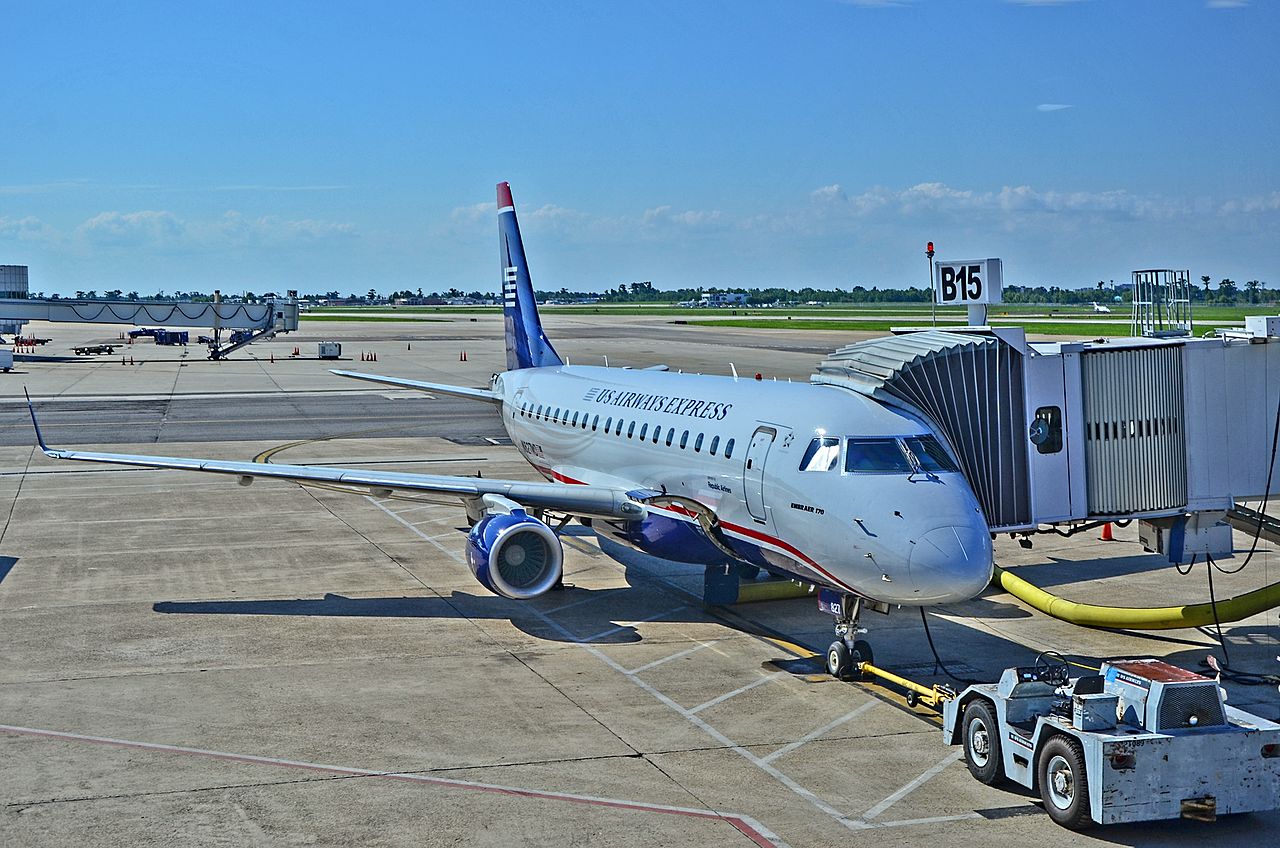 United Express aircraft on the tarmac boarding passengers before takeoff.