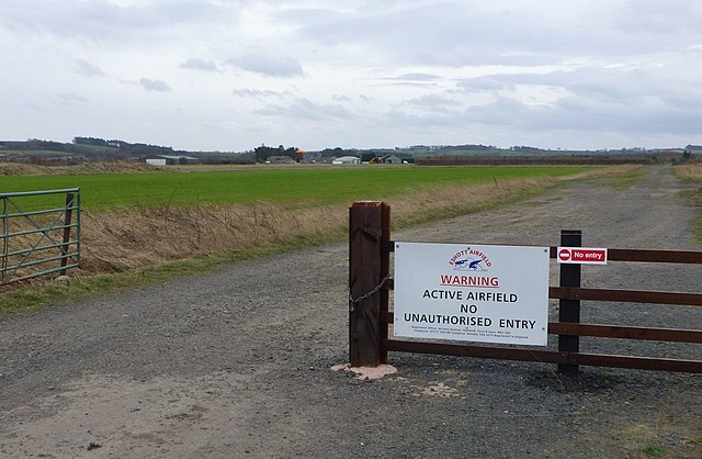 sign at airfield that reads "active airfield no unauthorised entry".
