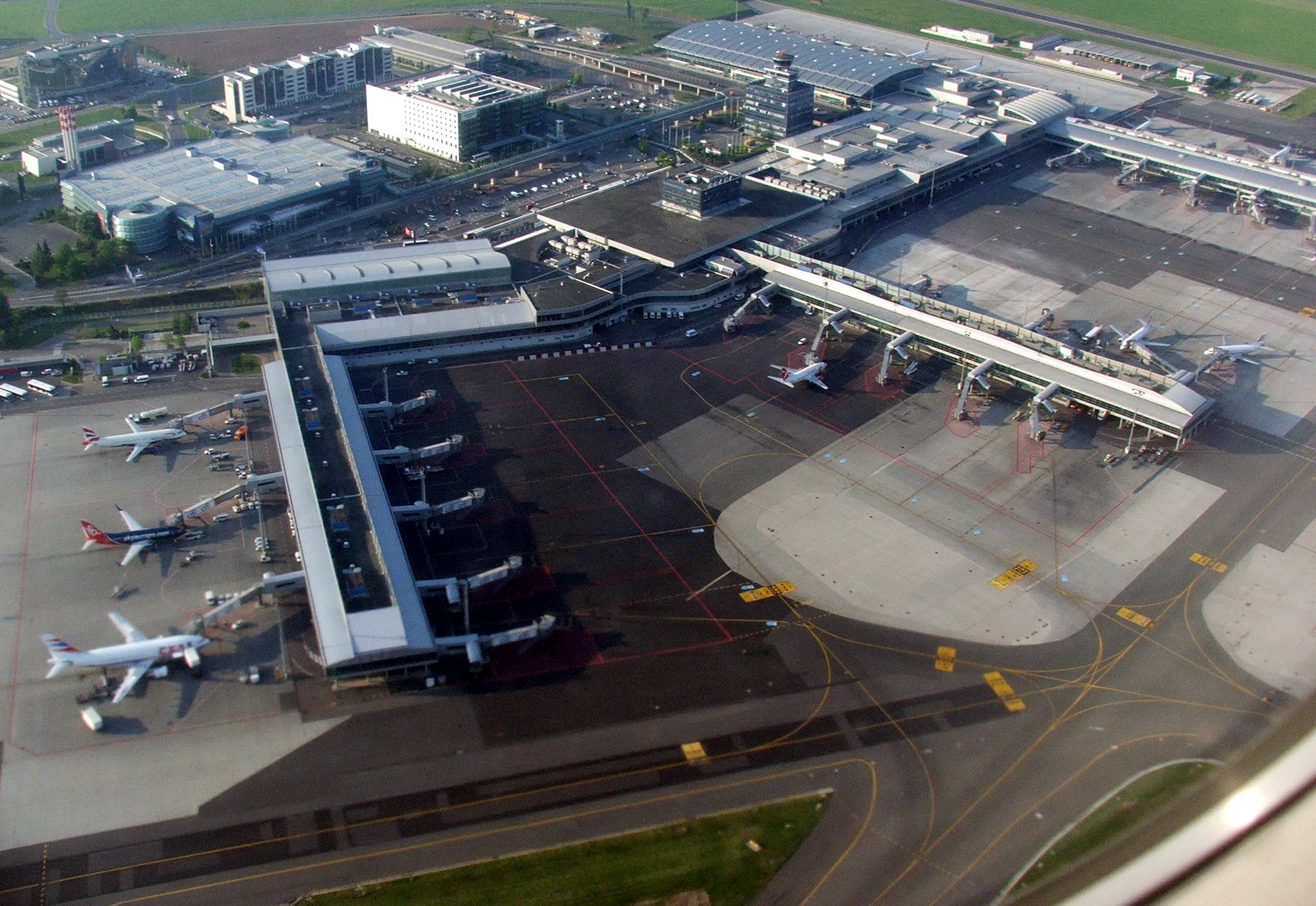 Aerial view of Prague’s Václav Havel Airport. Several aircraft are visible on the tarmac.