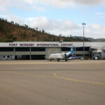 The exterior at Port Moresby International Airport showing tarmac and small jet