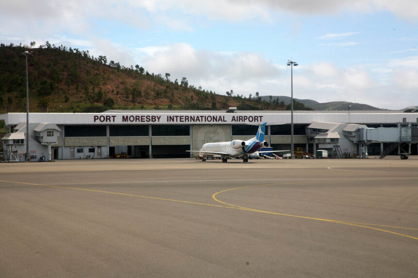 The exterior at Port Moresby International Airport showing tarmac and small jet