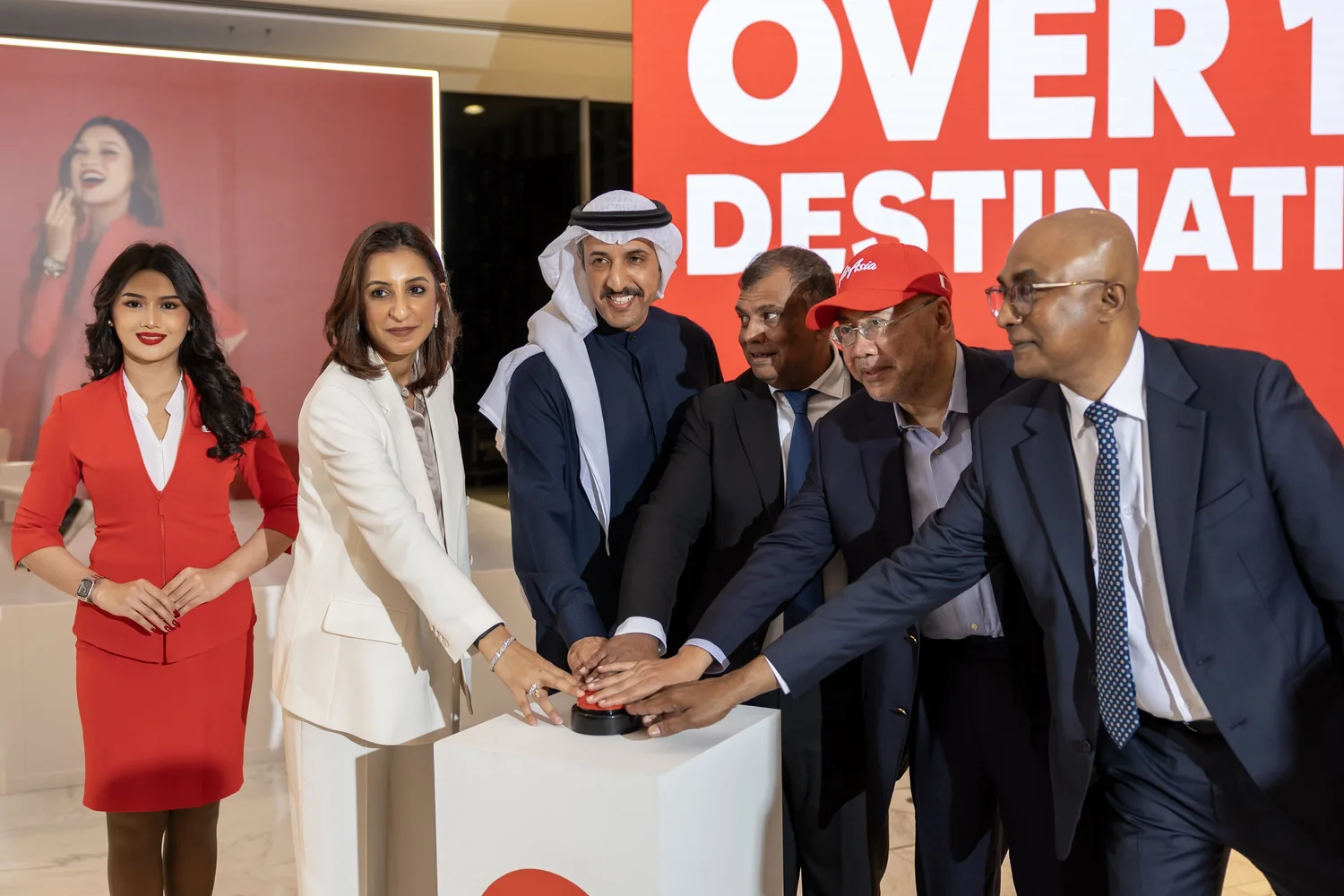 Bo Lingam, Tony Fernandes, and colleagues at a press event announcing new AirAsia X routes