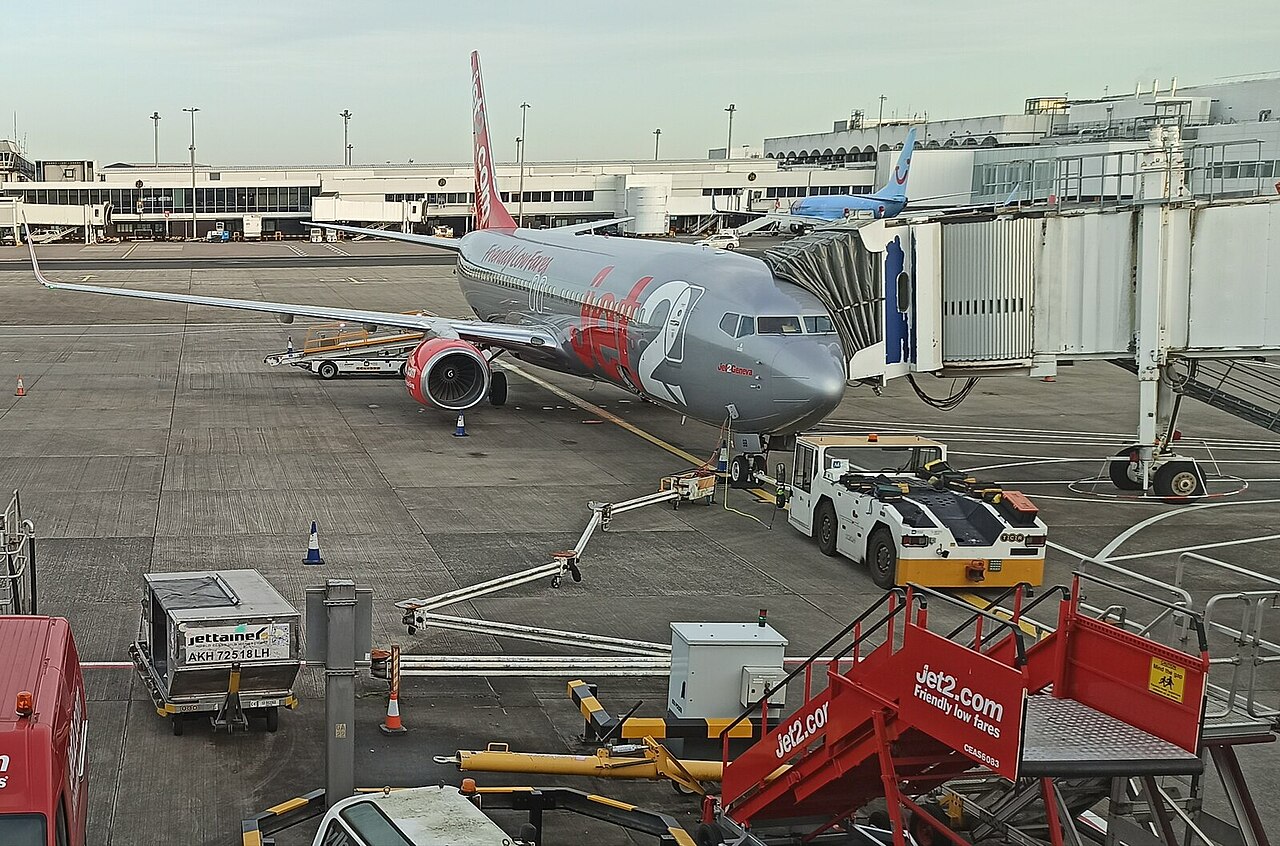 Jet2 aircraft at airport, passengers boarding.
