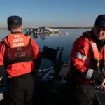 U.S. Coast Guard Petty Officer 2nd Class Lance Ide, left, and Petty Officer 3rd Class Corbin Singleton, boatswain’s mates at Station St. Inigoes, respond to the aircraft collision on the Potomac River, Washington, January 30, 2025. The Coast Guard responded to the incident with local, city, state and federal partners. (U.S. Coast Guard photo by Petty Officer 3rd Class Christopher Bokum)