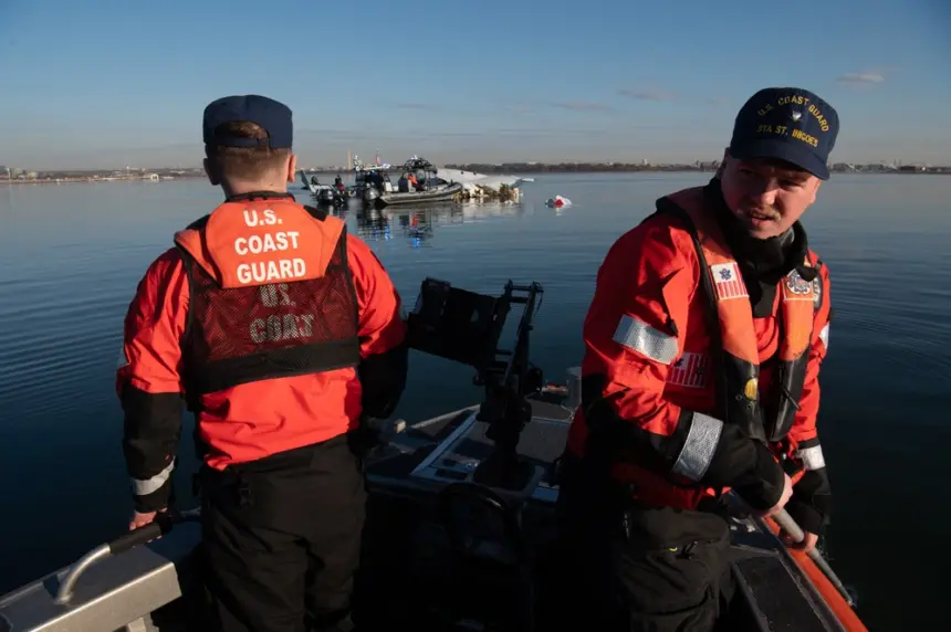 U.S. Coast Guard Petty Officer 2nd Class Lance Ide, left, and Petty Officer 3rd Class Corbin Singleton, boatswain’s mates at Station St. Inigoes, respond to the aircraft collision on the Potomac River, Washington, January 30, 2025. The Coast Guard responded to the incident with local, city, state and federal partners. (U.S. Coast Guard photo by Petty Officer 3rd Class Christopher Bokum)