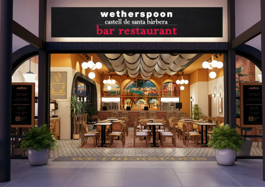 The storefront of the "Castell de Santa Bàrbera" pub, the first JD Wetherspoon location in mainland Europe, situated in the airside departures area of Alicante-Elche Miguel Hernández Airport. The entrance features a large blue sign with the pub's name in white lettering, located next to an airport restroom and opposite gate B30.