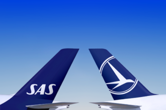 An image of two aircraft tails that belong to SAS and TAROM