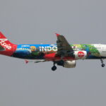 Indonesia AirAsia Airbus A320-200 flying in the air