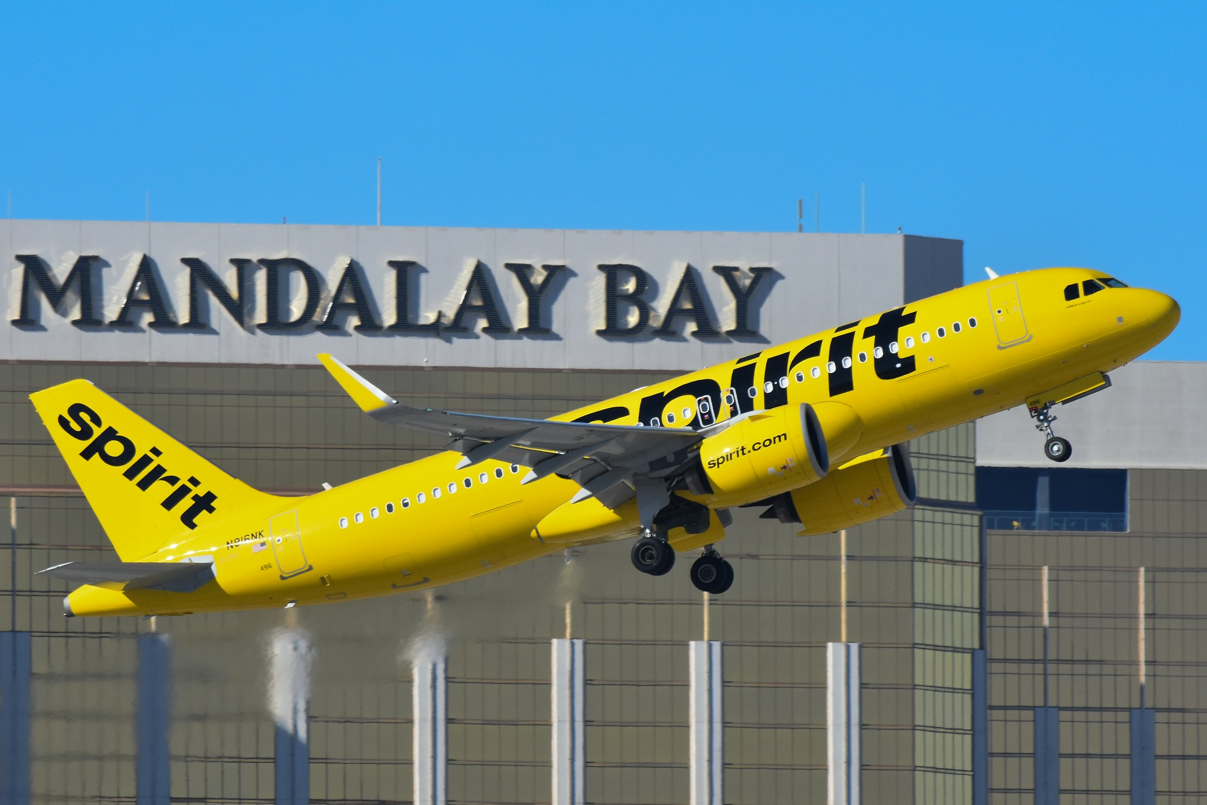 Spirit Airlines A320neo departing Las Vegas in front of the Mandalay Bay resort